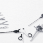 Advanced laparoscopic surgical instruments and trocars arranged on a textured white background for minimally invasive surgery procedures