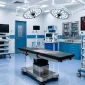 High-quality laparoscopy equipment, surgical lighting systems, and modular operating room tables inside an Indian ambulatory surgery center.